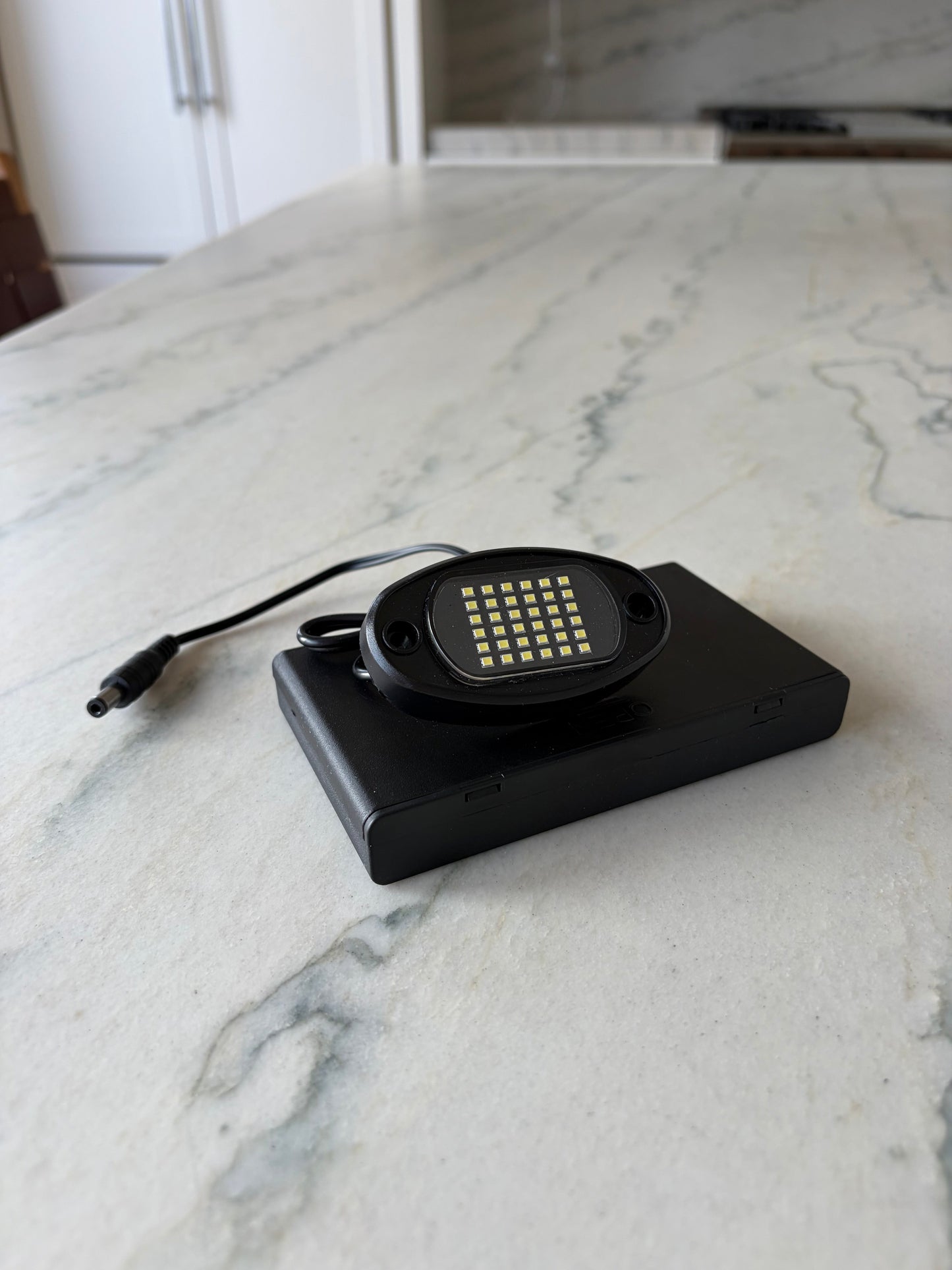 Battery powered rock light